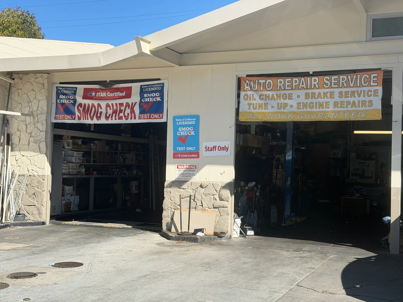 Exterior service bays and STAR Certified smog check signs at Star Smog San Mateo